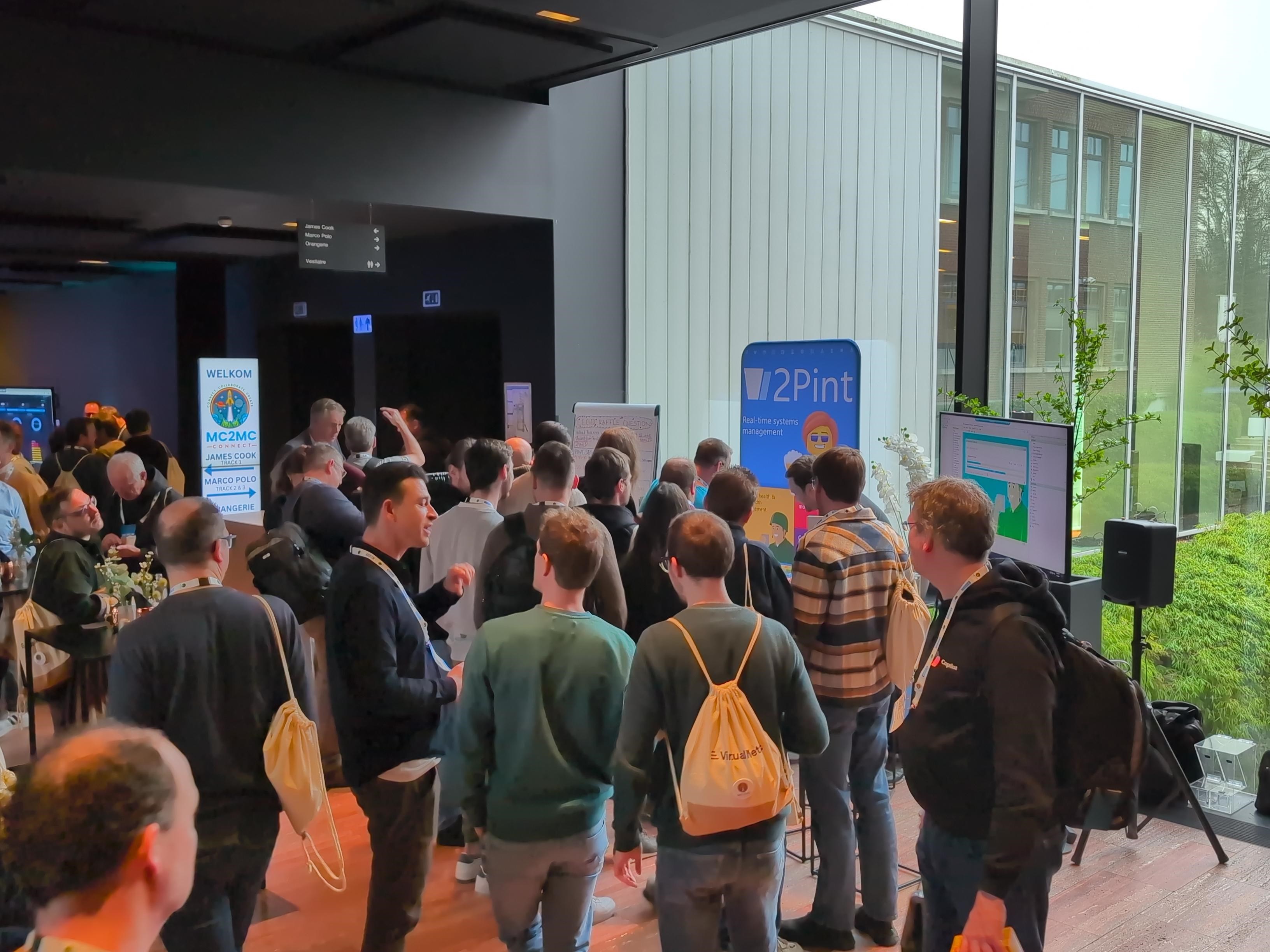 MC2MC-2Pint-booth.jpeg 2Pint Software booth and conference attendees at MC2MC 2026